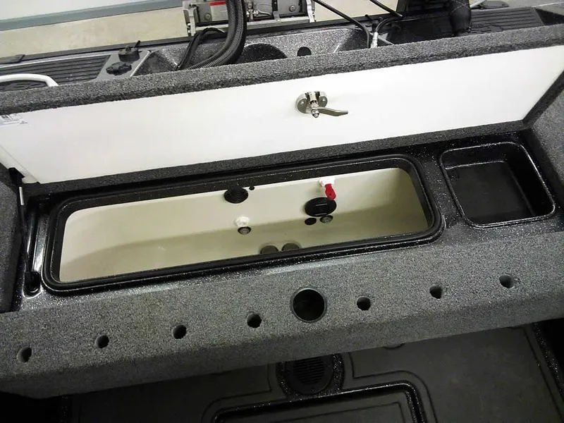 Slide: The Image of 2024 Ranger 622FS Pro DC boat storage compartment with open lid and organized interior. - 37