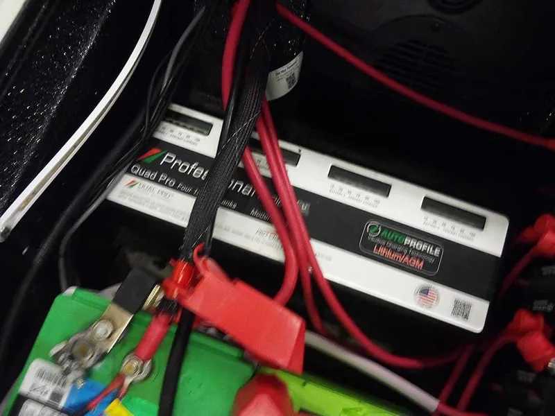 Slide: The Image of Battery compartment of 2024 Ranger 622FS Pro DC with wiring and connections. - 40