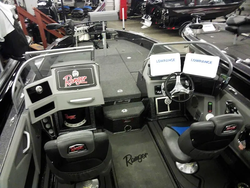 Slide: The Image of 2024 Ranger 622FS Pro DC boat interior with dual Lowrance displays and Ranger branding. - 9