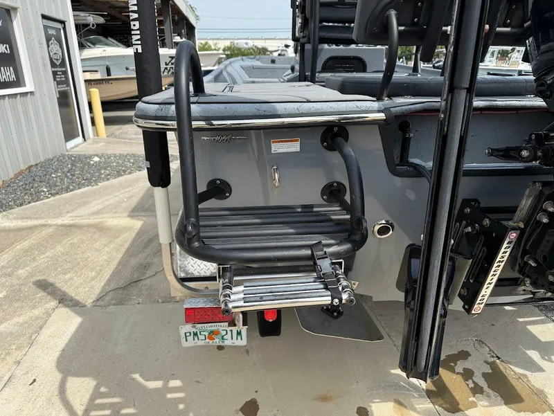 Slide: The Image of 2024 Blazer 2400 boat with rear boarding ladder and Florida license plate. - 11