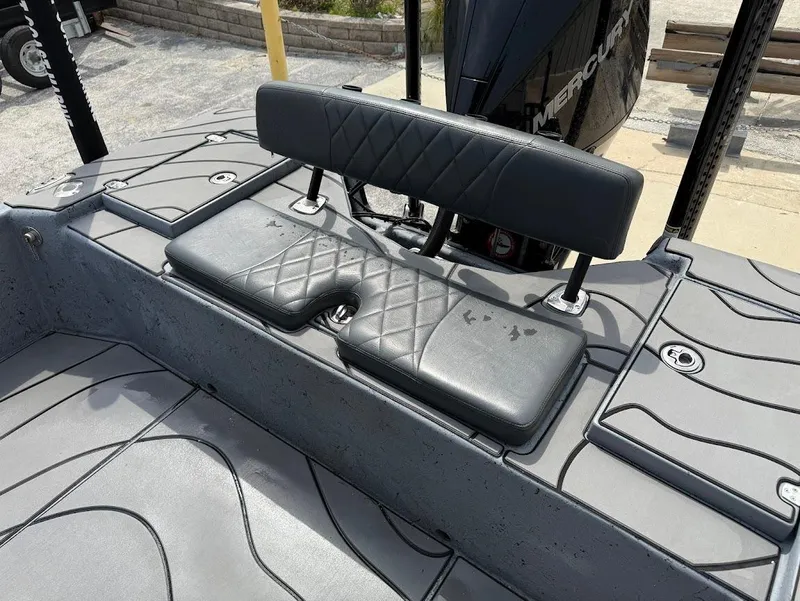 Slide: The Image of 2024 Blazer 2400 boat seating with quilted black cushions and sleek design. - 19