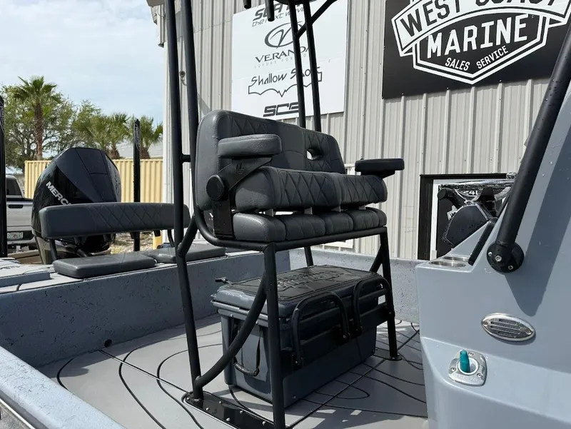 Slide: The Image of 2024 Blazer 2400 boat interior with cushioned seating and storage, displayed at West Coast Marine. - 5