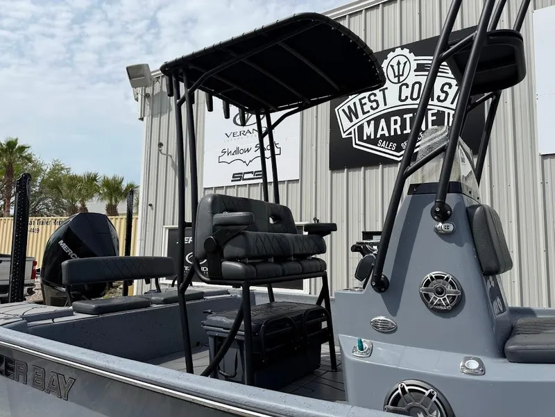 Slide: The Image of 2024 Blazer 2400 boat with canopy and seating, displayed at West Coast Marine. - 6