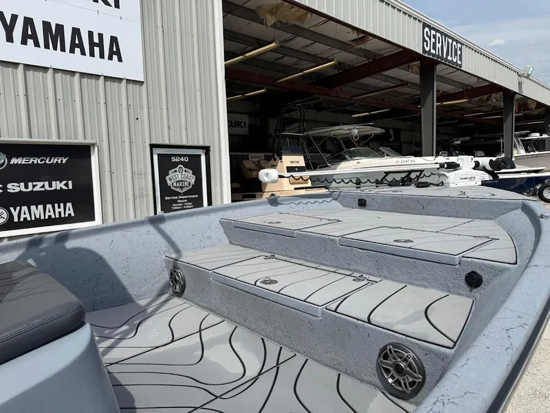 Slide: The Image of 2024 Blazer 2400 boat at service center with Yamaha signage. - 8