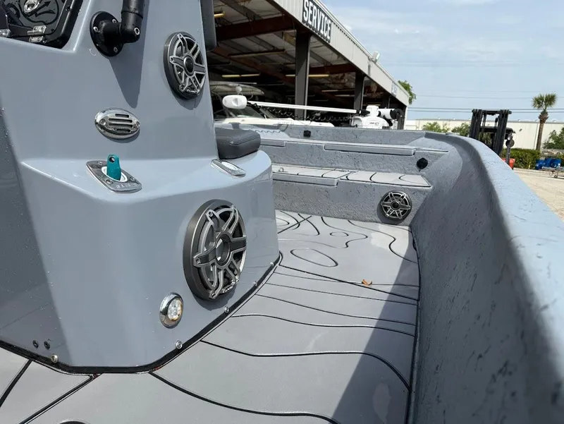 Slide: The Image of 2024 Blazer 2400 boat interior with speakers and modern design. - 9