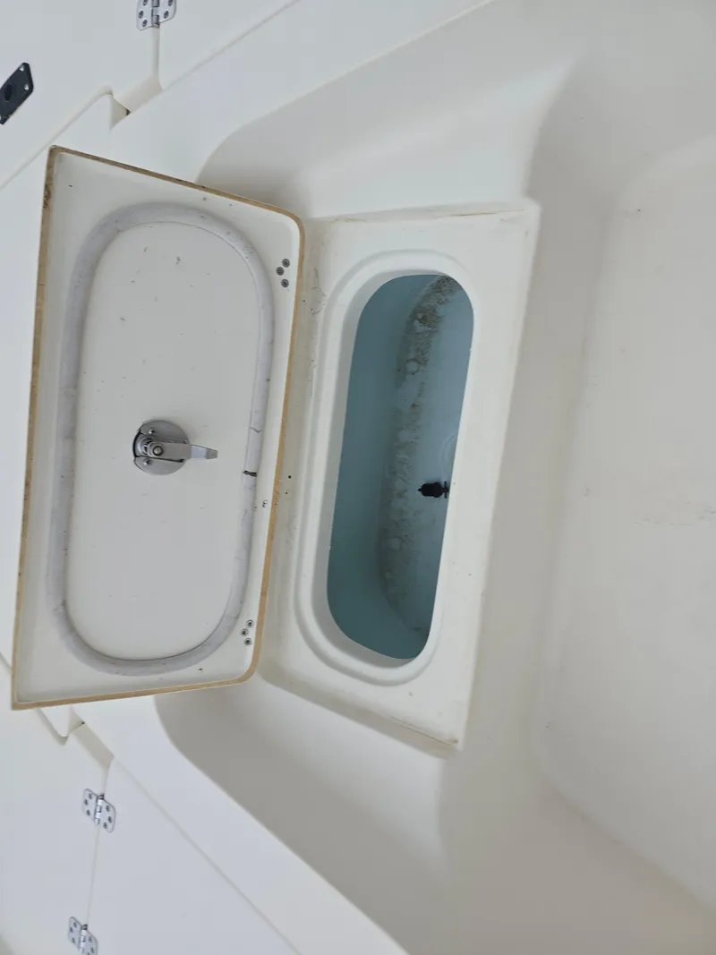 Slide: The Image of Open storage compartment on 2014 Key West 210 Bay Reef boat. - 12