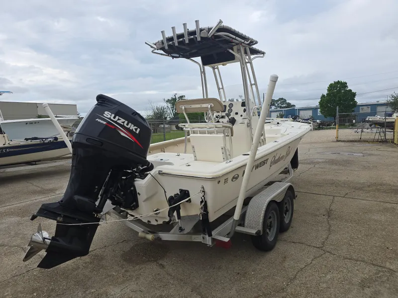 Slide: The Image of 2014 Key West 210 Bay Reef boat with Suzuki outboard motor on a trailer. - 5