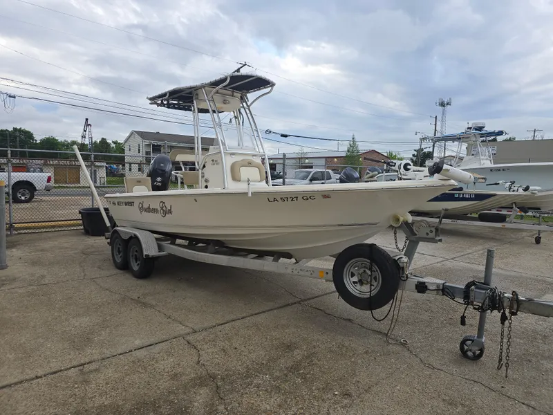 Slide: The Image of 2014 Key West 210 Bay Reef boat on trailer, parked outdoors. - 6