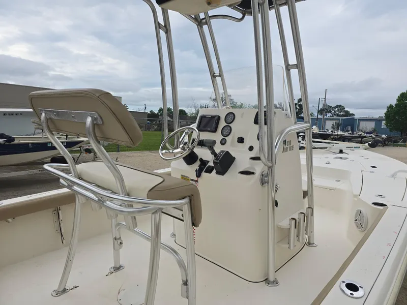 Slide: The Image of 2014 Key West 210 Bay Reef boat interior with steering console and seating. - 8