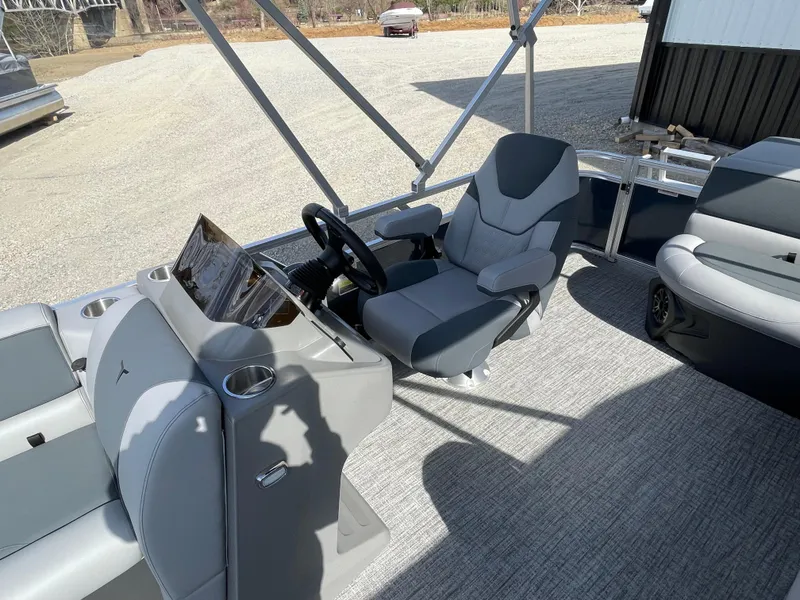 Slide: The Image of 2025 Tahoe Pontoon 1980 Sport Cruise interior with modern helm and seating. - 11