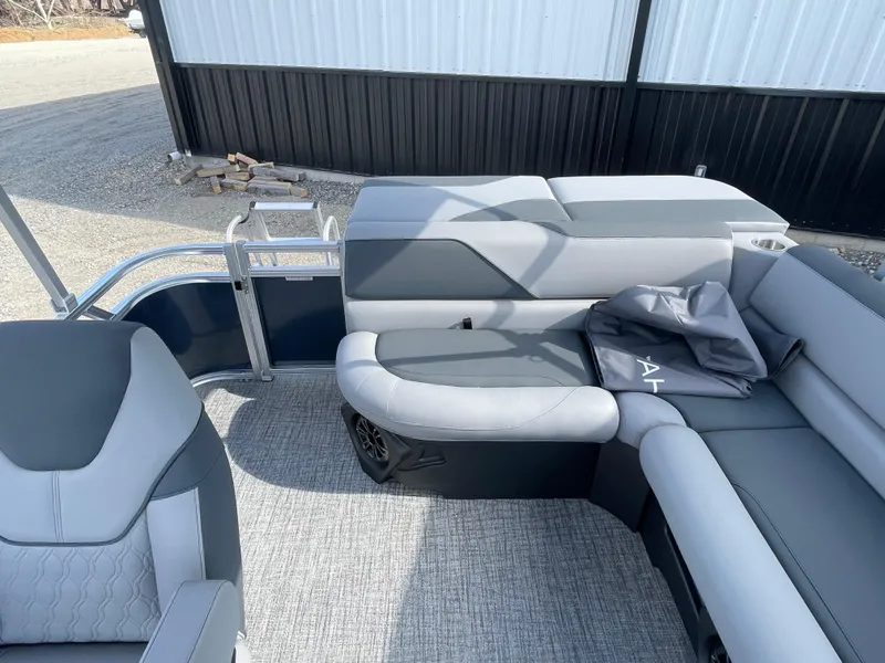 Slide: The Image of 2025 Tahoe Pontoon 1980 Sport Cruise interior with gray seating and modern design. - 12