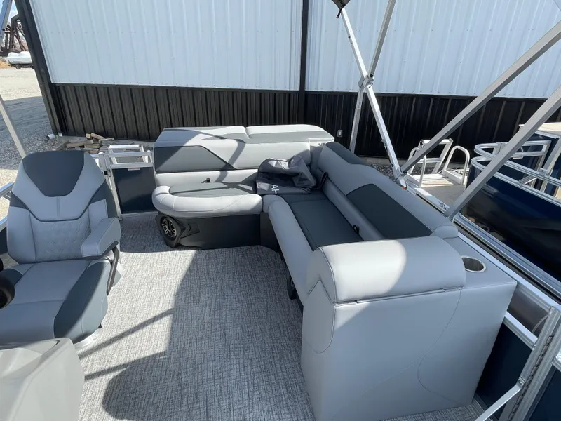 Slide: The Image of 2025 Tahoe Pontoon 1980 Sport Cruise interior with gray seating and carpeted floor. - 13