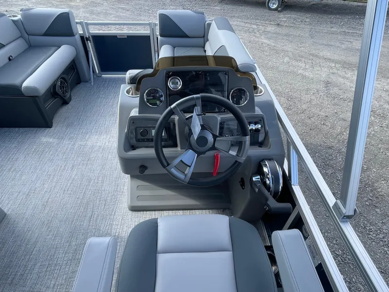Slide: The Image of 2025 Tahoe Pontoon 1980 Sport Cruise interior with modern steering and seating. - 16