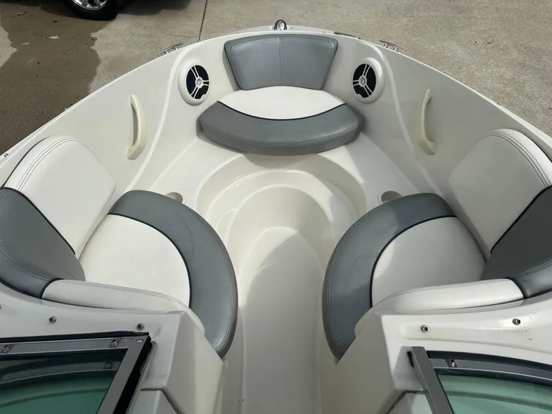 Slide: The Image of 2008 Sea Ray 185 Sport boat interior with gray and white seating. - 4