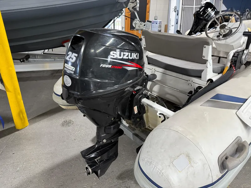 Slide: The Image of 2016 Highfield Classic 360 FCT with Suzuki 25HP outboard motor in a showroom. - 7