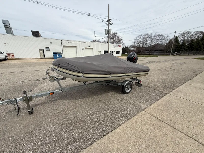 Slide: The Image of 2016 Highfield Classic 360 FCT boat on trailer, covered, parked in industrial area. - 9
