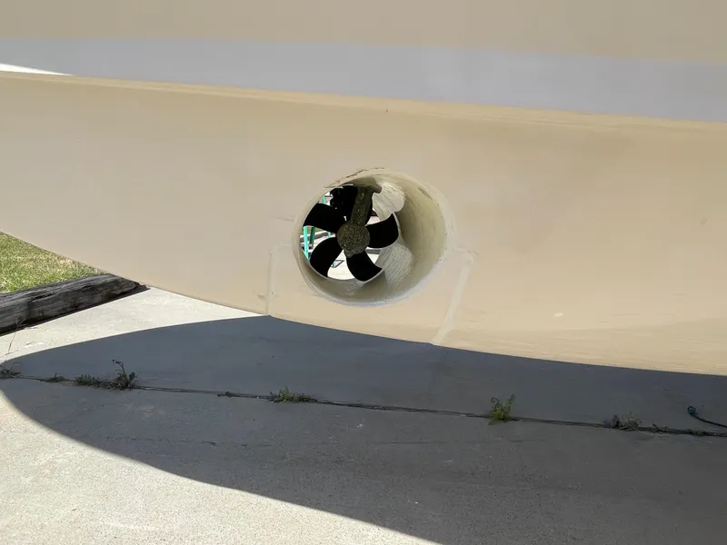 Slide: The Image of Bow thruster on a 2008 Grady-White Canyon 336 boat, docked on concrete. - 14