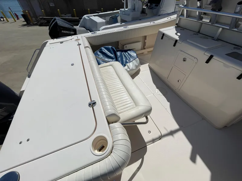 Slide: The Image of 2008 Grady-White Canyon 336 boat interior with seating and storage compartments. - 16