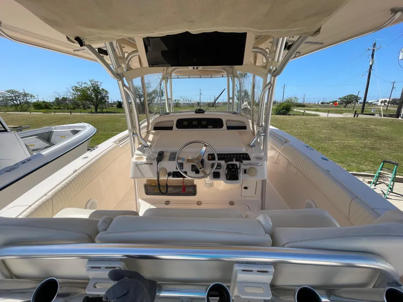 Slide: The Image of 2008 Grady-White Canyon 336 boat interior with steering wheel and controls. - 17
