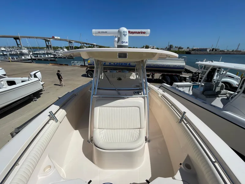 Slide: The Image of 2008 Grady-White Canyon 336 boat docked at marina under clear blue sky. - 23