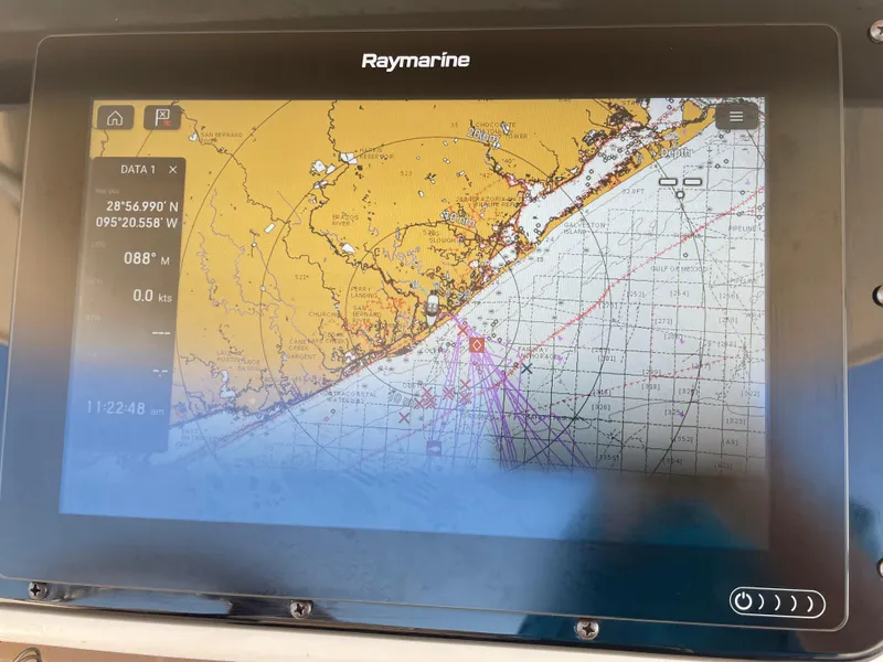 Slide: The Image of Raymarine navigation display on 2008 Grady-White Canyon 336 boat, showing nautical chart and coordinates. - 27