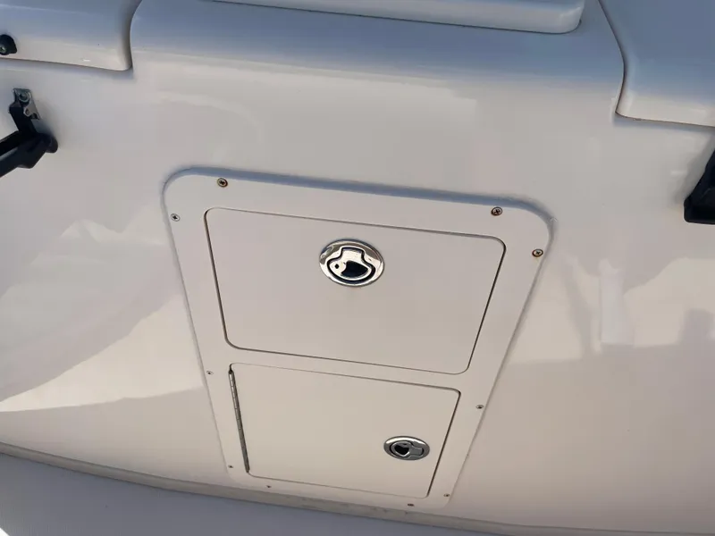 Slide: The Image of Grady-White Canyon 336 boat storage compartment, 2008 model, featuring secure latch. - 34