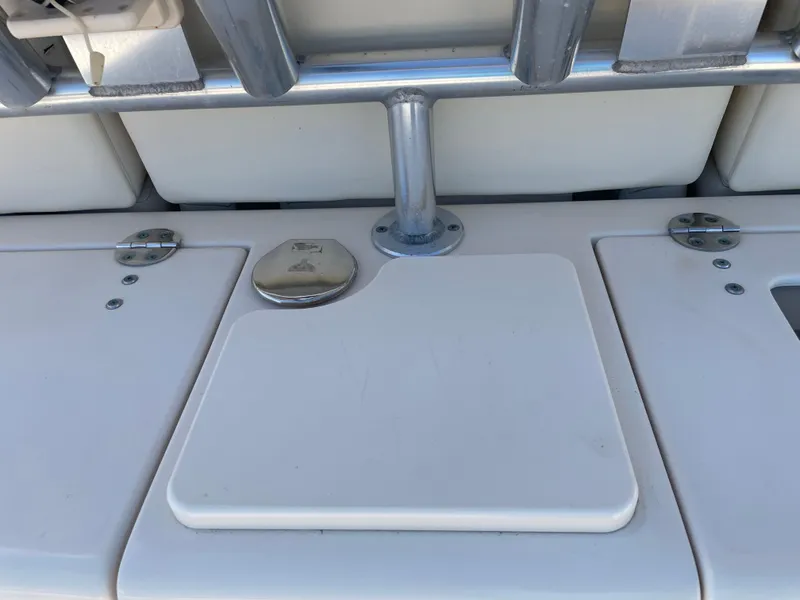 Slide: The Image of 2008 Grady-White Canyon 336 boat deck with storage compartments and metal fixtures. - 35