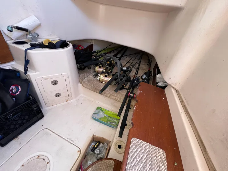 Slide: The Image of 2008 Grady-White Canyon 336 interior with fishing gear and equipment storage. - 42