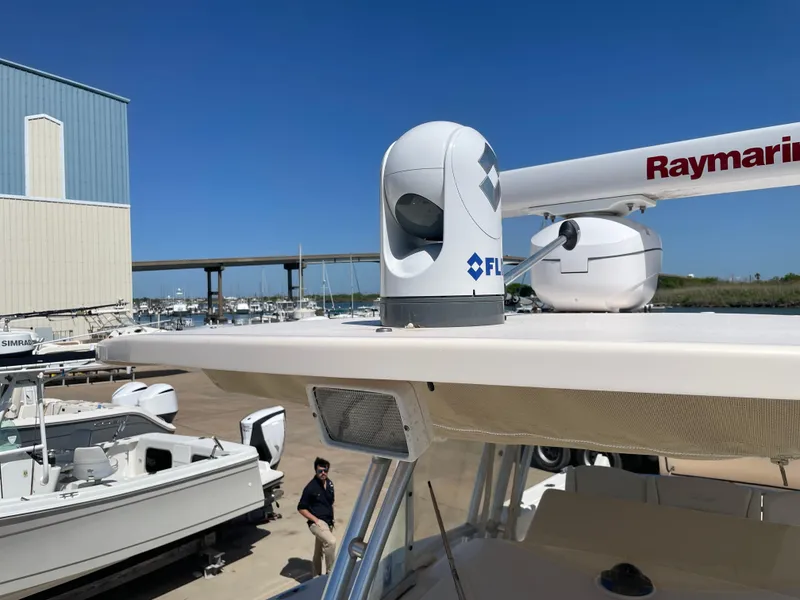 Slide: The Image of 2008 Grady-White Canyon 336 boat with Raymarine and FLIR equipment at a marina. - 44