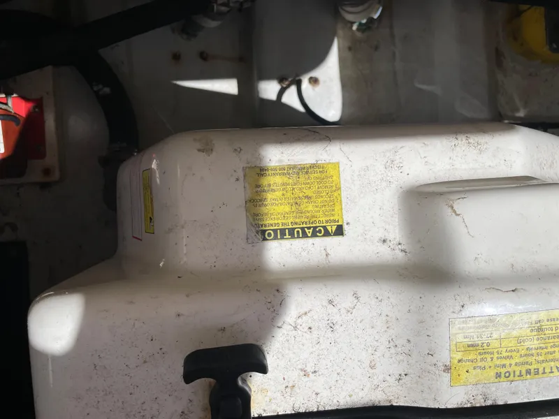 Slide: The Image of Engine compartment of 2008 Grady-White Canyon 336 boat with caution labels. - 46