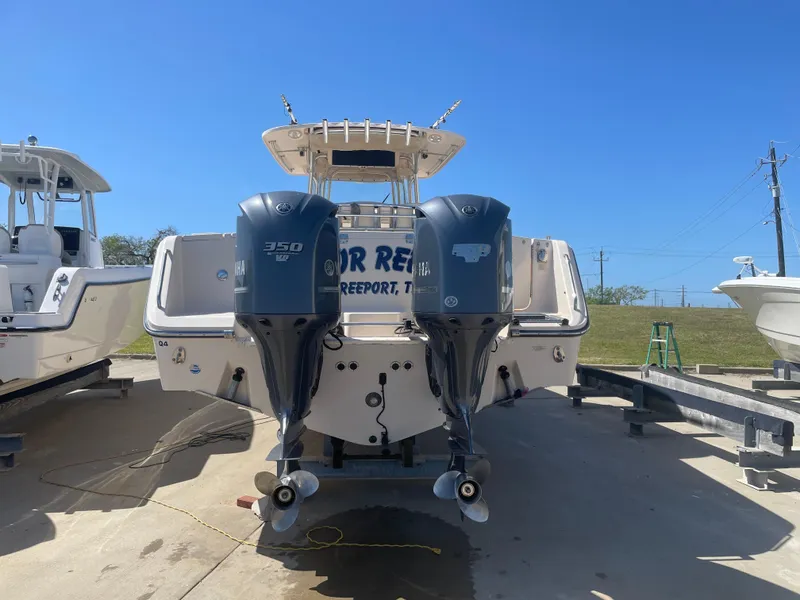 Slide: The Image of 2008 Grady-White Canyon 336 boat with twin 350 HP engines, docked outdoors. - 5