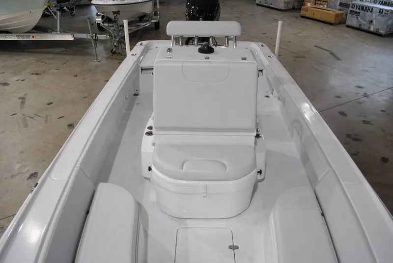 Slide: The Image of 2025 Contender 25 Bay boat interior with seating and storage compartments. - 13