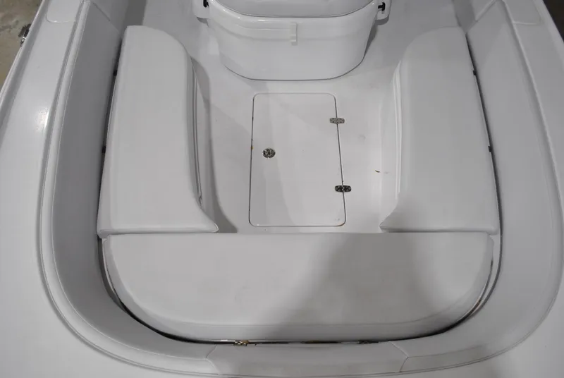 Slide: The Image of 2025 Contender 25 Bay boat interior with storage compartment and seating. - 14