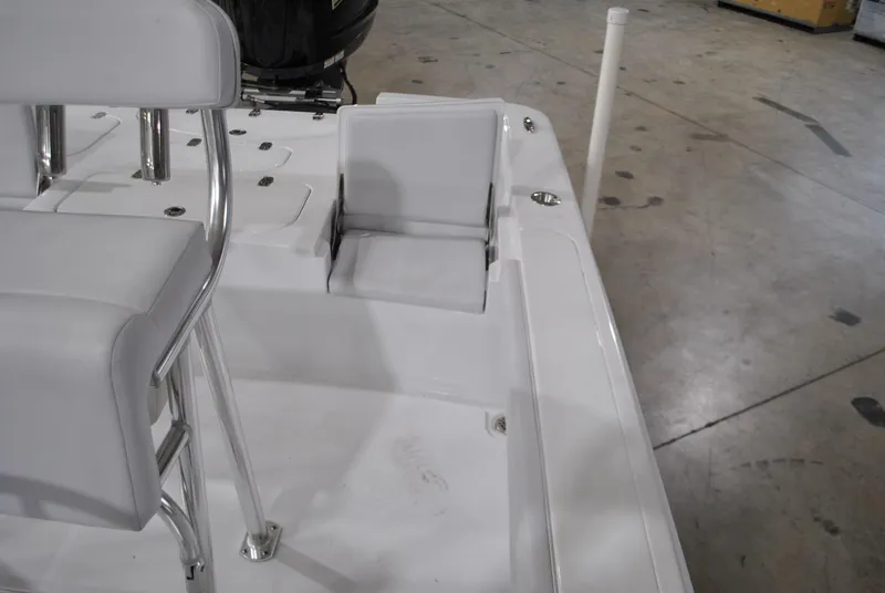 Slide: The Image of 2025 Contender 25 Bay boat interior with white seating and sleek design. - 18