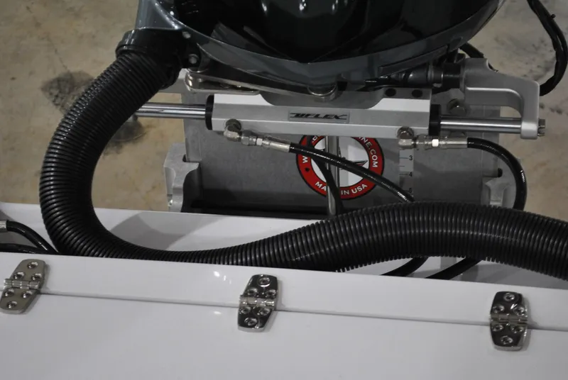 Slide: The Image of 2025 Contender 25 Bay boat engine components and hydraulic system close-up. - 22