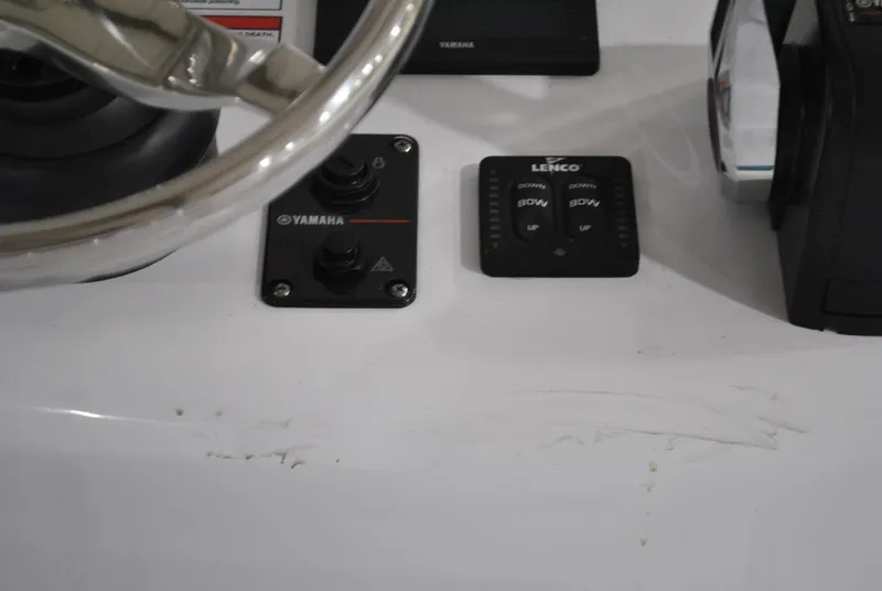 Slide: The Image of Control panel of 2025 Contender 25 Bay boat with Yamaha and Lenco switches. - 24
