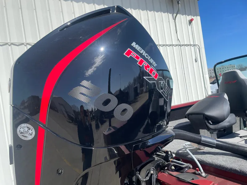 Slide: The Image of 2024 Alumacraft Competitor 205 Sport with Mercury Pro 300 engine, outdoor setting. - 12