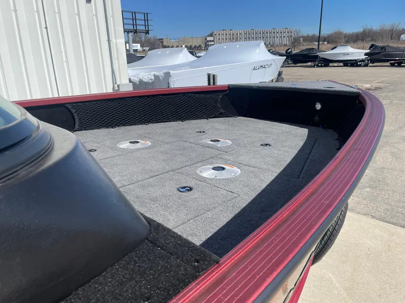 Slide: The Image of 2024 Alumacraft Competitor 205 Sport boat deck, featuring a spacious, carpeted surface. - 14