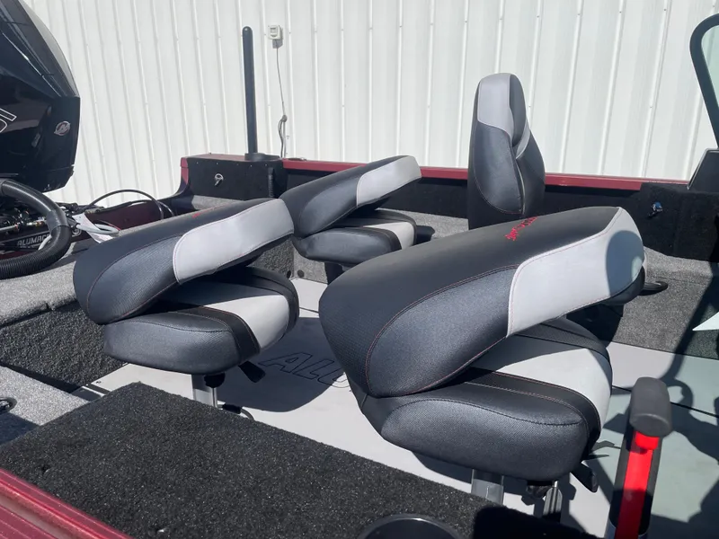 Slide: The Image of 2024 Alumacraft Competitor 205 Sport boat seats, featuring sleek black and gray design. - 15