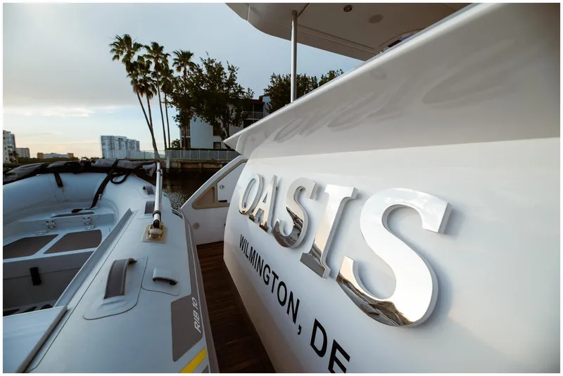 Slide: The Image of Azimut 2022 Fly yacht named "Oasis" docked, featuring sleek design and modern aesthetics. - 11