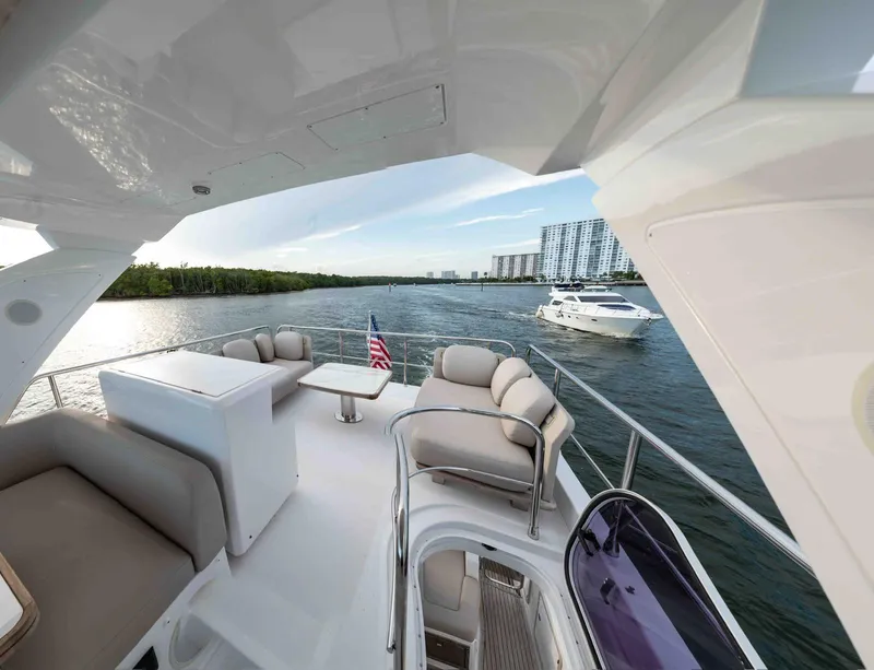 Slide: The Image of Luxurious 2022 Azimut 50 Fly yacht with spacious deck and scenic waterfront view. - 15