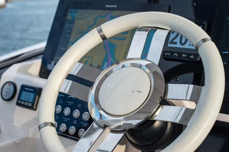 Slide: The Image of Steering wheel of 2022 Azimut 50 Fly yacht with navigation display. - 19