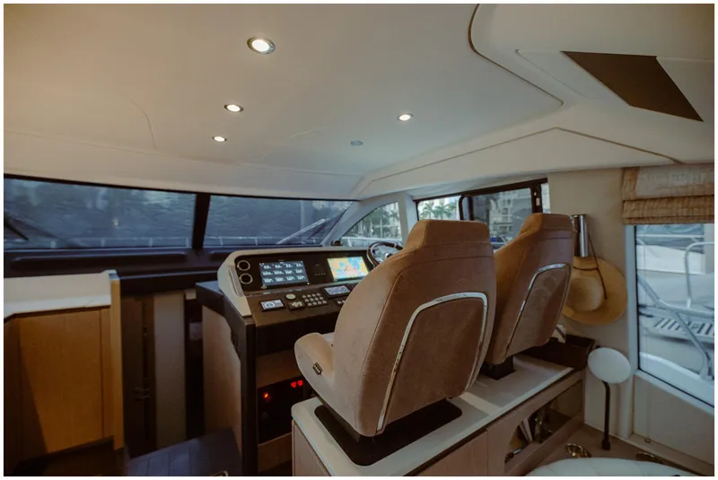 Slide: The Image of Luxurious interior of 2022 Azimut Fly yacht with modern cockpit and plush seating. - 22