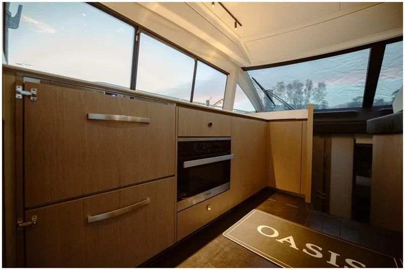 Slide: The Image of Interior of 2022 Azimut Fly yacht with modern kitchen and panoramic windows. - 25