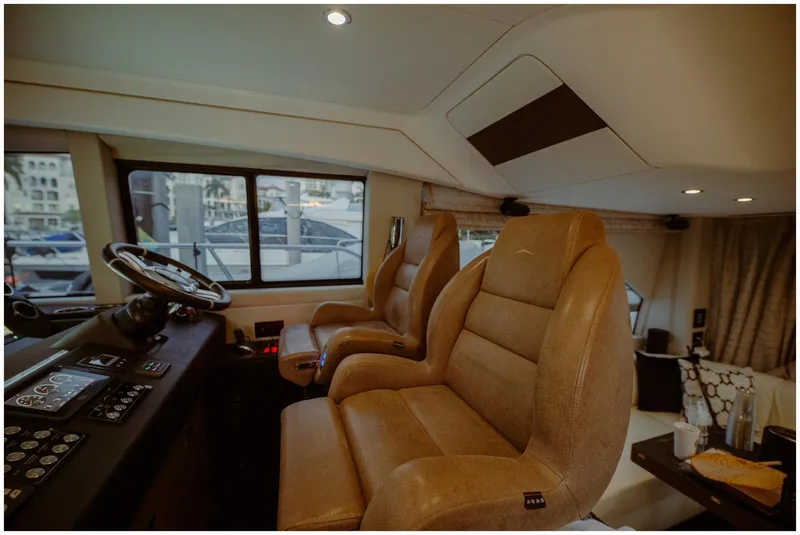 Slide: The Image of Interior of 2022 Azimut Fly yacht with luxurious leather seating and modern dashboard. - 26