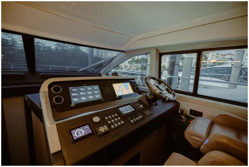 Slide: The Image of Luxurious Azimut 2022 Fly yacht cockpit with advanced navigation controls and plush seating. - 27