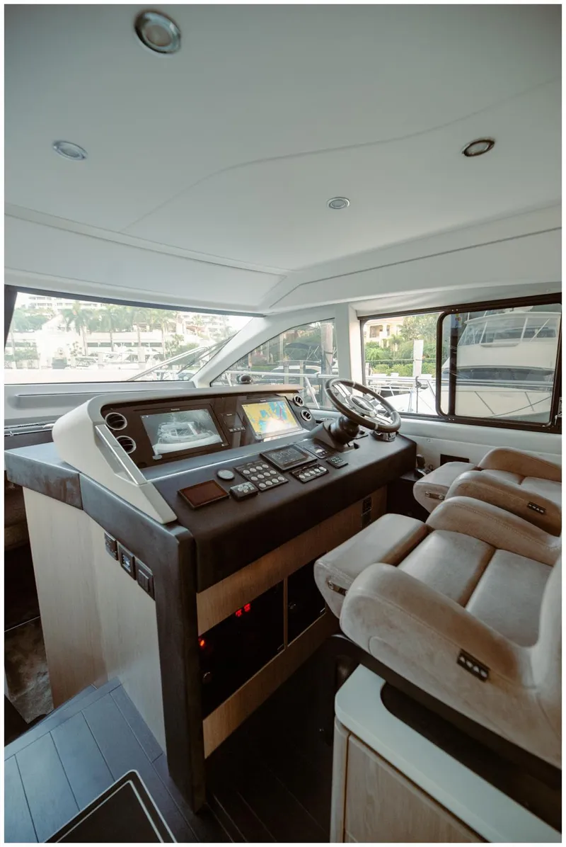 Slide: The Image of Luxurious Azimut 2022 Fly yacht cockpit with modern controls and plush seating. - 36