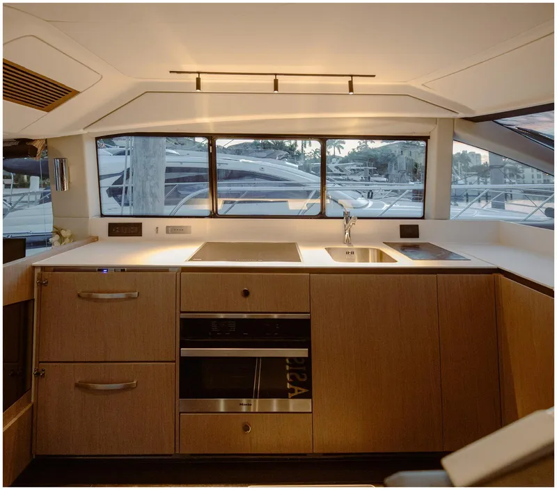 Slide: The Image of Modern kitchen interior of 2022 Azimut Fly yacht with sleek design and appliances. - 38