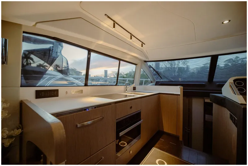 Slide: The Image of Modern kitchen interior of 2022 Azimut Fly yacht with sleek design and panoramic windows. - 39