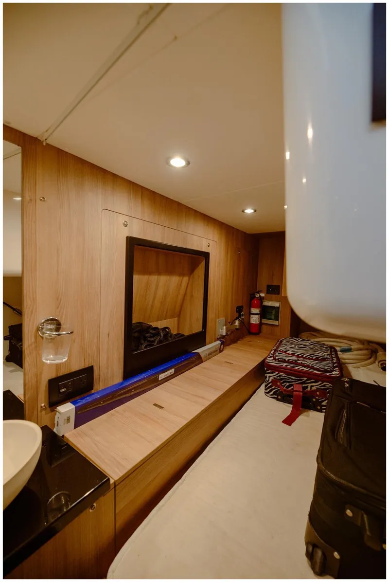 Slide: The Image of Interior of 2022 Azimut Fly yacht with wooden paneling and modern amenities. - 53